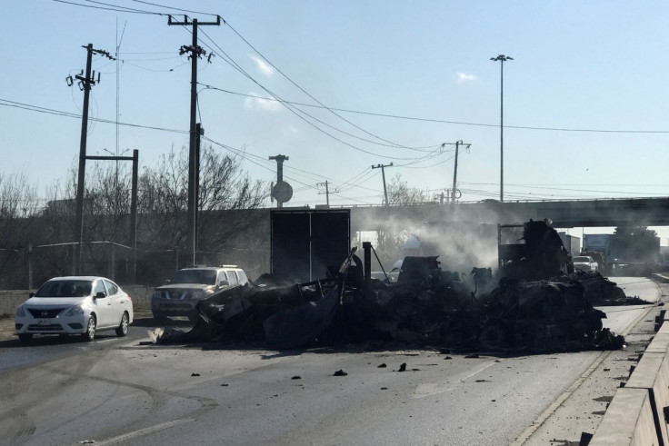 The charred wreckage of a trailer, which was set ablaze by suspected gang members following the detention of one of its leaders, is pictured in Nuevo Laredo, Mexico March 14, 2022. 