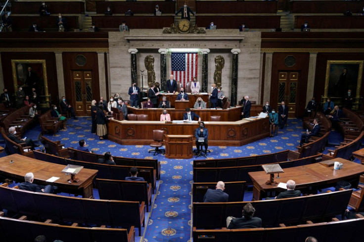 U.S. Vice President Mike Pence and Speaker of the House Nancy Pelosi (D-CA), stand after reading the final certification of Electoral College votes cast in November's presidential election during a joint session of Congress after working through the night