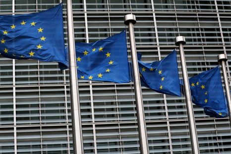 European Union flags fly outside the European Commission headquarters in Brussels, Belgium, March 6, 2019. 