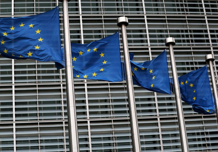 European Union flags fly outside the European Commission headquarters in Brussels, Belgium, March 6, 2019. 