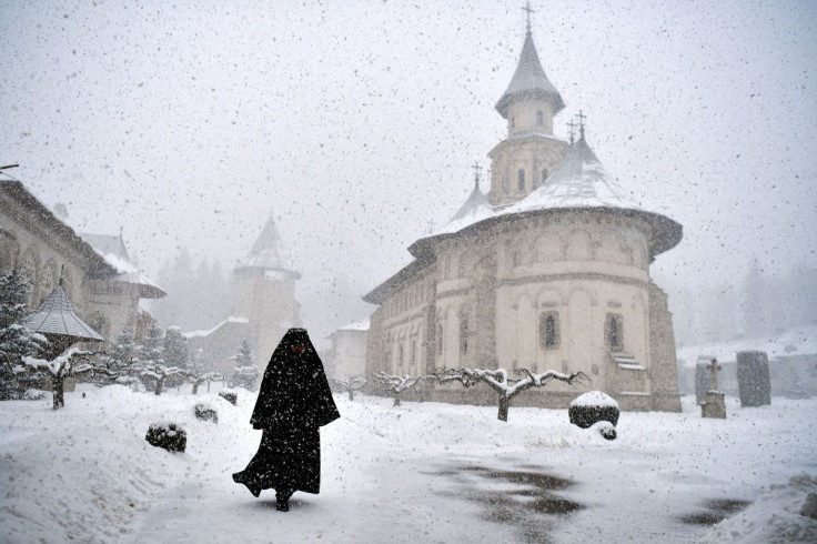 Romanian Orthodox monk, Father Mikhail, departs after the mass at the Church in Putna Monastery, Putna, Romania, March 8, 2022. During the mass, blessings were also given for Ukrainian refugees who are fleeing amid Russia's invasion. Picture taken March 8