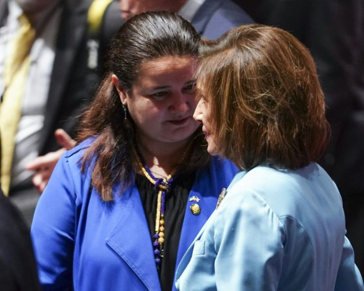 Ukrainian Ambassador to the United States Oksana Markarova (L) speaks with US House speaker Nancy Pelosi prior to President Volodymyr Zelensky's address to the US Congress