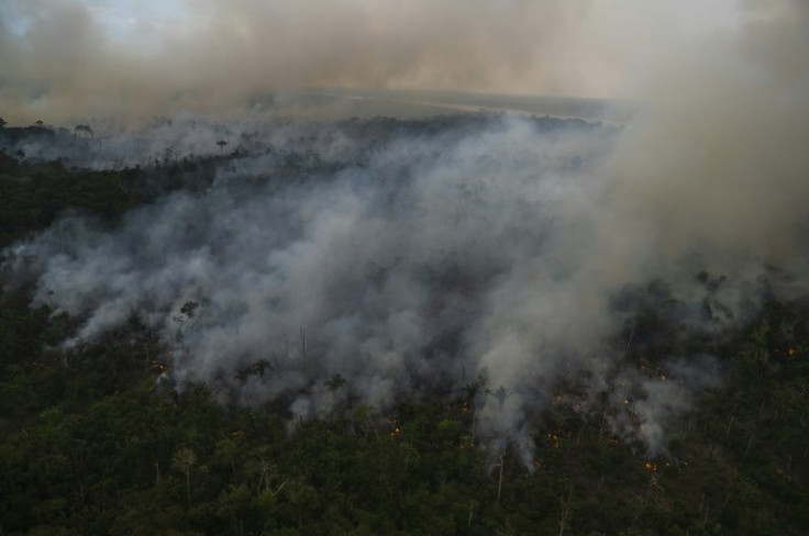 In this aerial file photo taken on September 15, 2021 smoke rising from an illegal fire destroying Amazonia rainforest is seen in Porto Velho, Rondonia state, Brazil