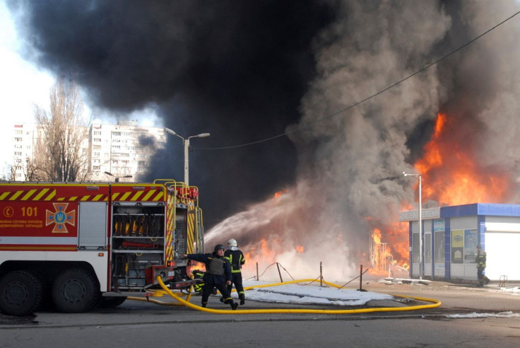 Firefighters work at a site of a fire, as Russia's invasion of Ukraine continues, in Kharkiv, Ukraine March 16, 2022. 