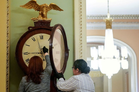 Employees with the Architect of the Capitol wind the Ohio Clock in the U.S. Capitol in Washington, U.S., January 21, 2020. 