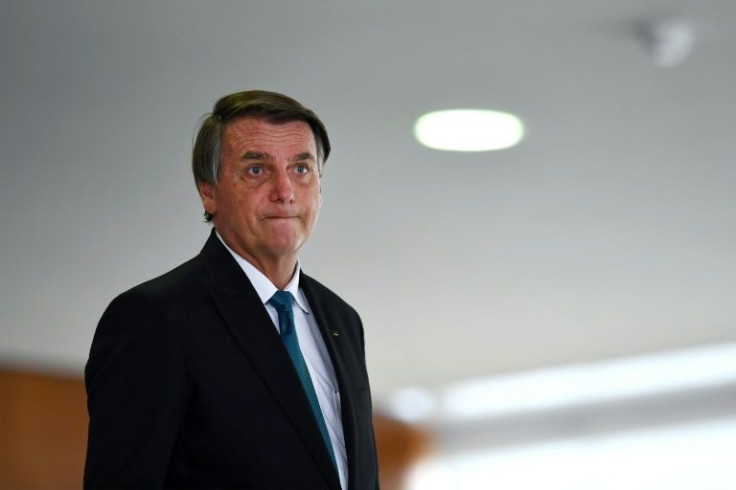 Soaring prices and sluggish growth are hurting Brazilians' wallets and Jair Bolsonaro's (pictured March 15, 2022) popularity as the far-right president fights an uphill battle to win reelection in October 2022