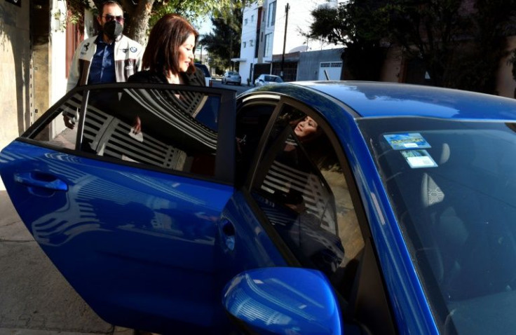 Mexican journalist Maria Martinez is accompanied by armed bodyguards when she goes out due to death threats against her