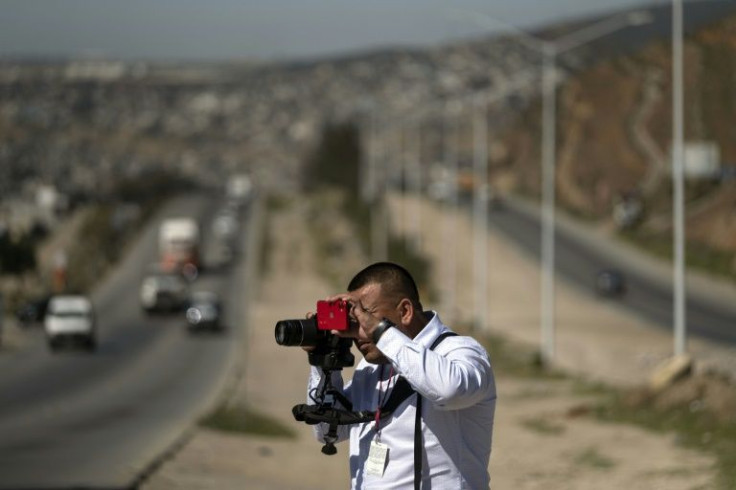 Mexican journalist Jesus Aguilar photographs security forces' seizure of an alleged fentanyl lab in the border city of Tijuana