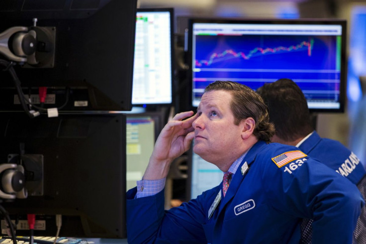 A trader waits for a press conference on the floor of the New York Stock Exchange in New York September 17, 2015.