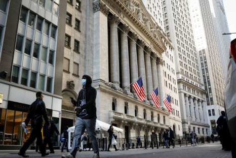 A man wears a mask as he walks near the New York Stock Exchange (NYSE) in the financial district in New York City, U.S., March 2, 2020. 