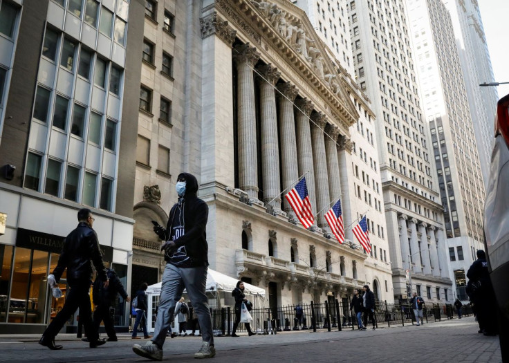 A man wears a mask as he walks near the New York Stock Exchange (NYSE) in the financial district in New York City, U.S., March 2, 2020. 