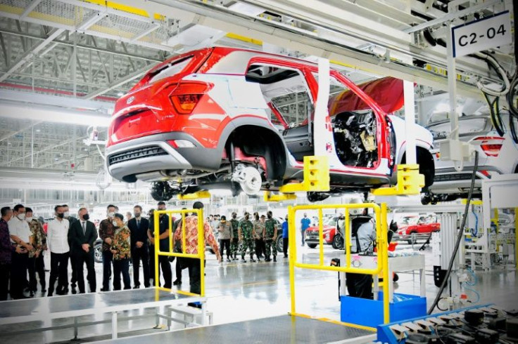 Indonesia's President Joko Widodo (fourth from left in white shirt) visits the Hyundai factory