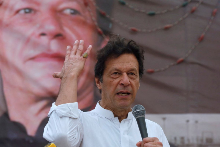 Imran Khan, chairman of the Pakistan Tehreek-e-Insaf (PTI), gestures while addressing his supporters during a campaign meeting ahead of general elections in Karachi, Pakistan, July 4, 2018. 