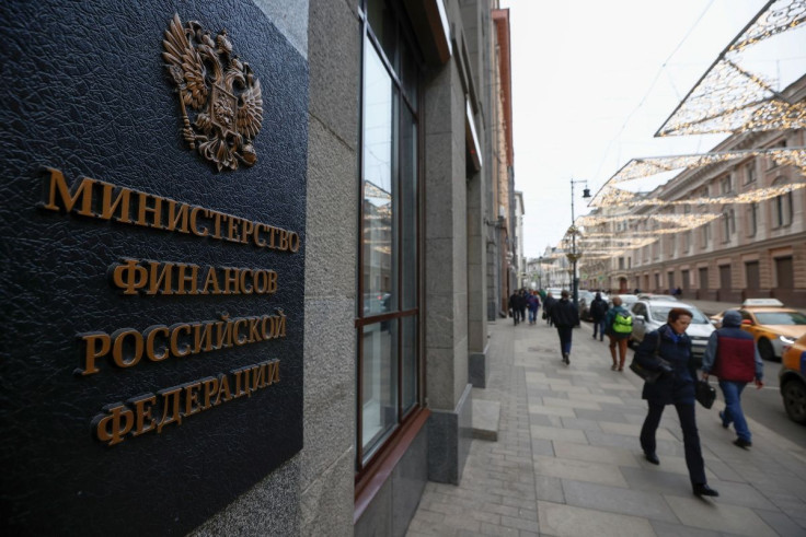 Pedestrians walk past Russia's Finance Ministry building in Moscow, Russia March 30, 2021.  