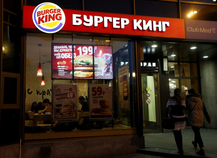 Women walk outside a Burger King restaurant in Moscow, Russia, September 15, 2015. 