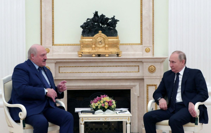 Russian President Vladimir Putin listens to Belarusian President Alexander Lukashenko during a meeting at the Kremlin in Moscow, Russia March 11, 2022. Sputnik/Mikhail Klimentyev/Kremlin via REUTERS 