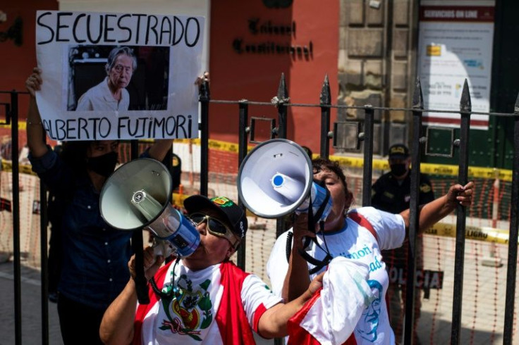 Supporters of Peru's former president Alberto Fujimori take part in a demonstration in front of the Constitutional Court in Lima, on March 17, 2022