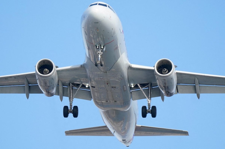 An Airbus A319, equipped with radar altimeters that may conflict with telecom 5G technology, can be seen flying 500 feet above the ground while on final approach to land at LaGuardia Airport in New York City, New York, U.S., January 6, 2022.