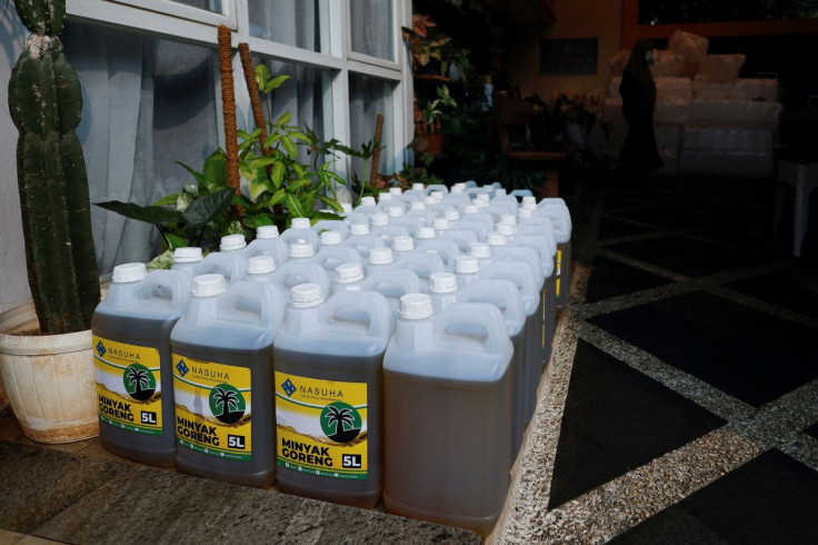 Containers with cooking oil to be distributed to residents are seen at a local filling station after stocks ran out in Jakarta, Indonesia, March 10, 2022.