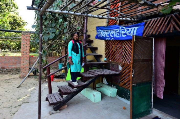 Meera Devi, the outlet's managing editor, outside her office. She says her work is driven by a passion for giving a voice to those left out of India's success story