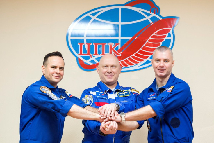 Russian cosmonauts Oleg Artemyev, Denis Matveev and Sergey Korsakov pose for a picture during a news conference ahead of the expedition to the International Space Station (ISS) at the Baikonur Cosmodrome, Kazakhstan March 17, 2022. Roscosmos/Handout via R