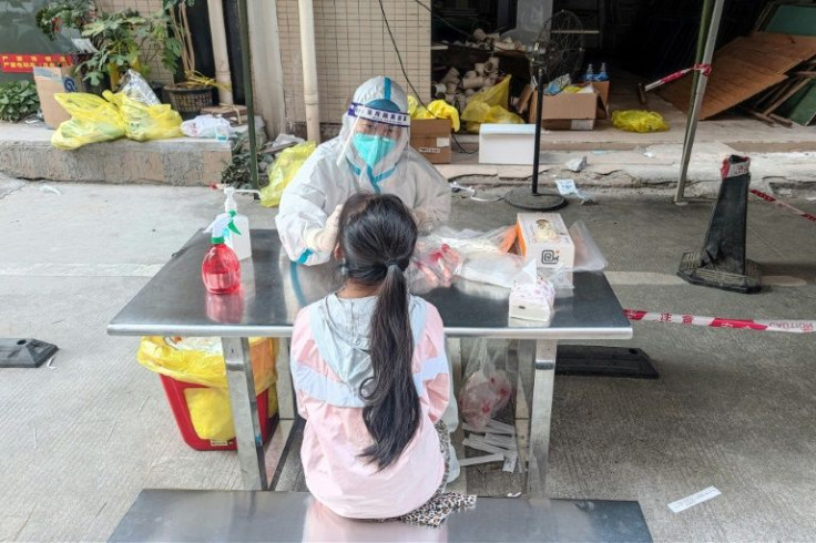 A resident undergoes a coronavirus test in Shenzhen