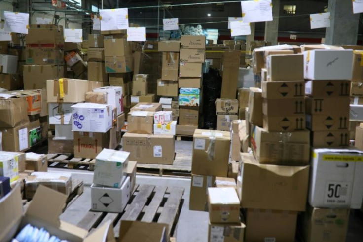 Boxed donations include noodles, bandages and drinking water