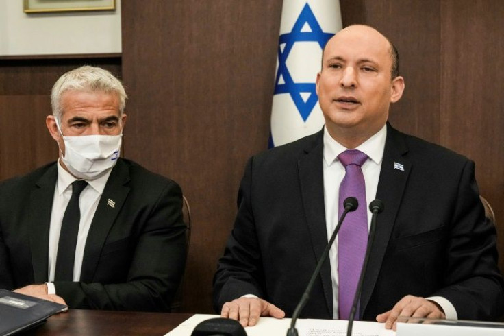 Israeli Prime Minister Naftali Bennett and Foreign Minister Yair Lapid at a cabinet meeting last month