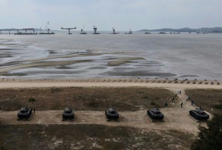 This photo taken on October 20, 2020 shows an aerial view of anti-landing spikes and retired tanks placed along the coast of Taiwan's Kinmen islands, which lie just 3.2 kms (two miles) from the mainland China coast (in background) in the Taiwan Strait.The