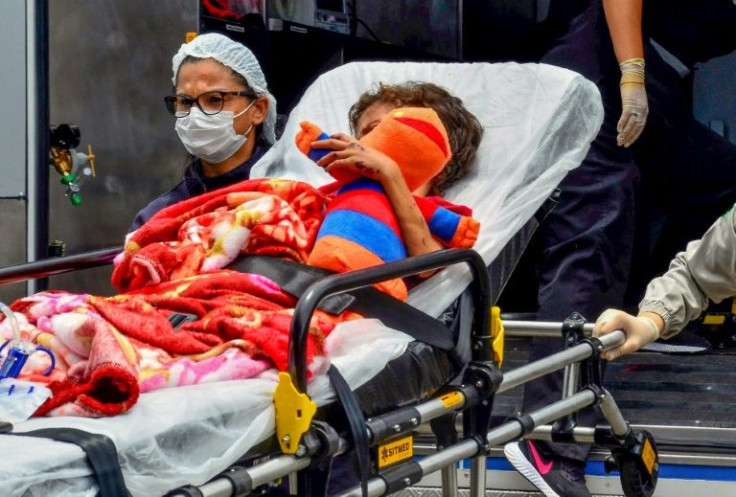 Glauco, 7, arrives at a hospital in Manaus, Brazil, on March 17, 2022, after being lost with his brother in the Amazon rainforest for 25 days