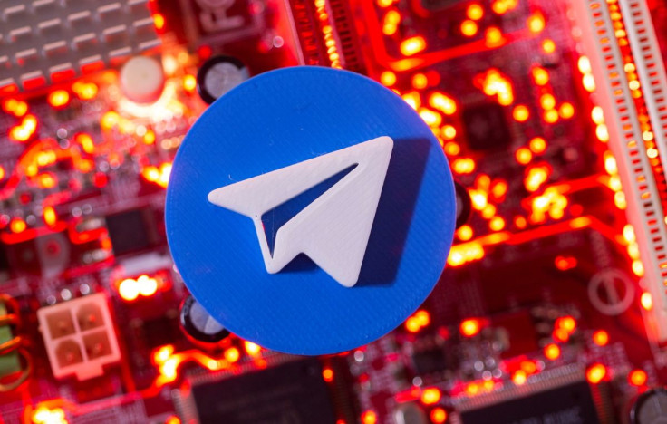 A 3D printed Telegram logo is placed on a computer motherboard in this illustration taken January 21, 2021.