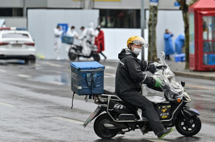 Scooter food-delivery riders help keep people fed as many Shanghai residents shelter at home