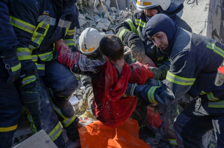 Rescuers face a relentless task after a Russian military strike on a barracks at Mykolaiv in southern Ukraine