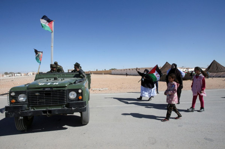 People greet Sahrawi soldiers during the visit of U.N. envoy to Western Sahara, January 15, 2022. Picture taken January 15, 2022.