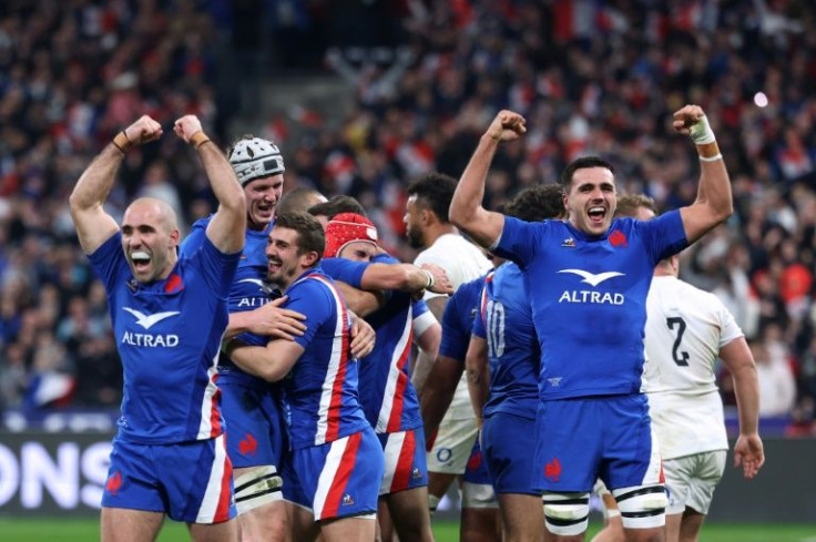 France's players celebrate after winning the Six Nations and achieving their first Grand Slam in 12 years with a win over England in Paris