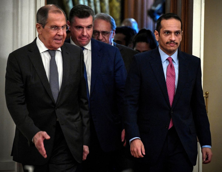 Russian Foreign Minister Sergei Lavrov walks with Qatari Foreign Minister Sheikh Mohammed bin Abdulrahman Al-Thani in Moscow, Russia September 11, 2021.  Alexander Nemenov/Pool via 