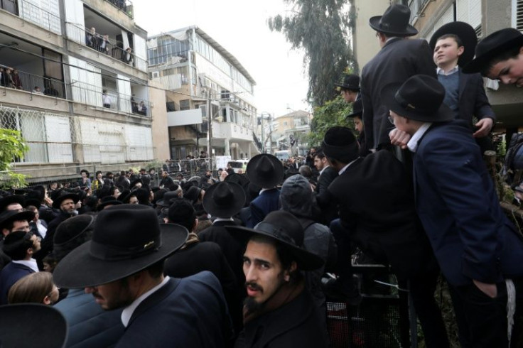 Ultra-Orthodox Jewish men and children gather outside the home of late rabbi Chaim Kanievsky, ahead of his funeral in the Israeli city of Bnei Brak near Tel Aviv