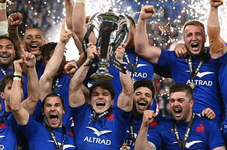 France's players celebrate with the Six Nations trophy
