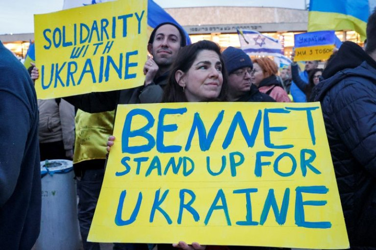 People protest in Tel Aviv against Russia's invasion of Ukraine ahead of a televised address by the Ukrainian president