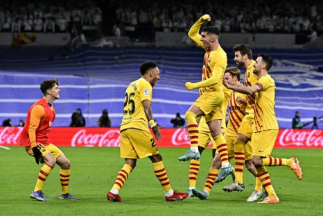 Pierre-Emerick Aubameyang celebrates his second goal in Barcelona's 4-0 thrashing of Real Madrid on Sunday