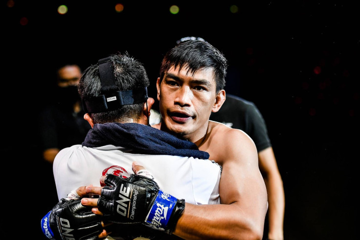 Eduard Folayang hugs Team Lakay coach Mark Sangiao