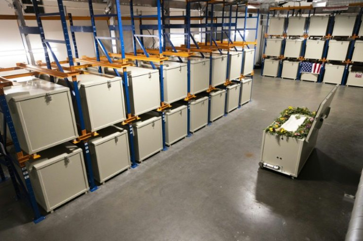 A demonstration "vessel" for the deceased is pictured (R) among the other vessels during a tour of the Return Home funeral home which specializes in human composting in Auburn, Washington on March 14, 2022