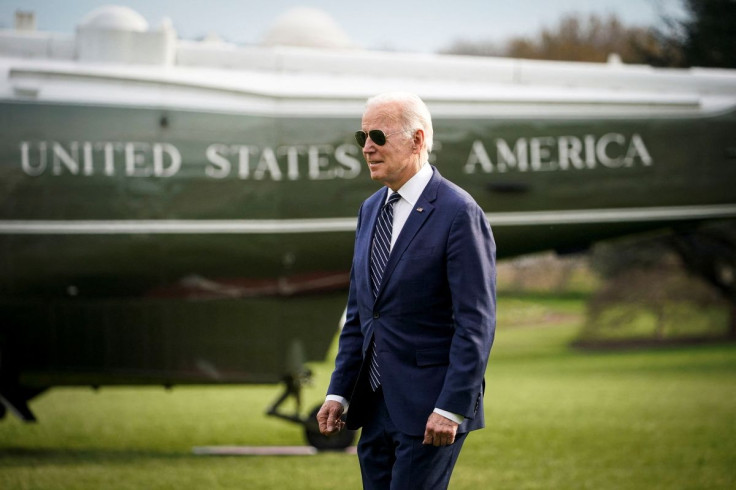 U.S. President Joe Biden walks to board Marine One, before traveling to Rehoboth Beach, Delaware for the weekend, on the South Lawn of the White House in Washington, U.S., March 18, 2022. 