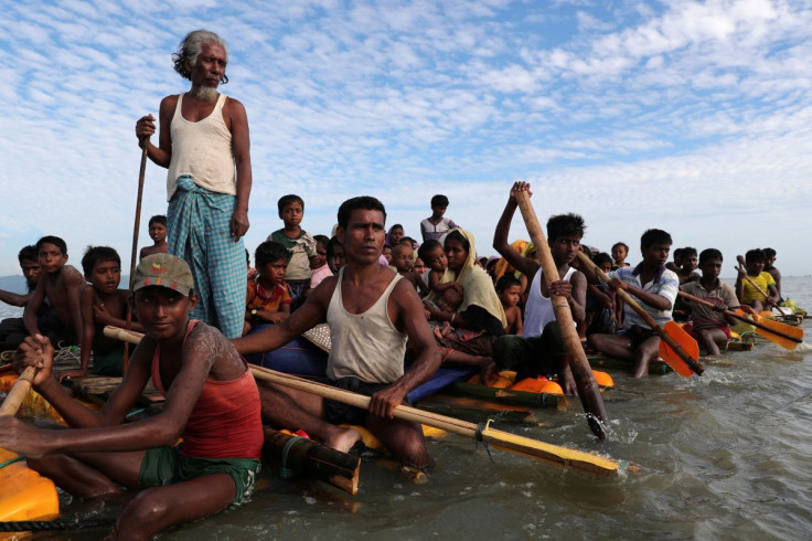 Rohingya refugees cross the Naf River with an improvised raft to reach to Bangladesh in Teknaf, Bangladesh, November 12, 2017. 