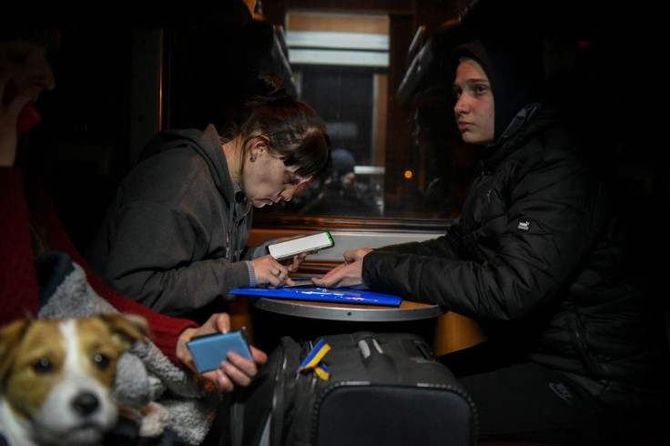 Ludmila Lichko, 40, from Mykolaiv, and her son Vladislav, 16, travel on an evacuation train as they flee Russiaâs invasion of Ukraine, on their way from Odesa to Ismail, Ukraine, March 16, 2022.