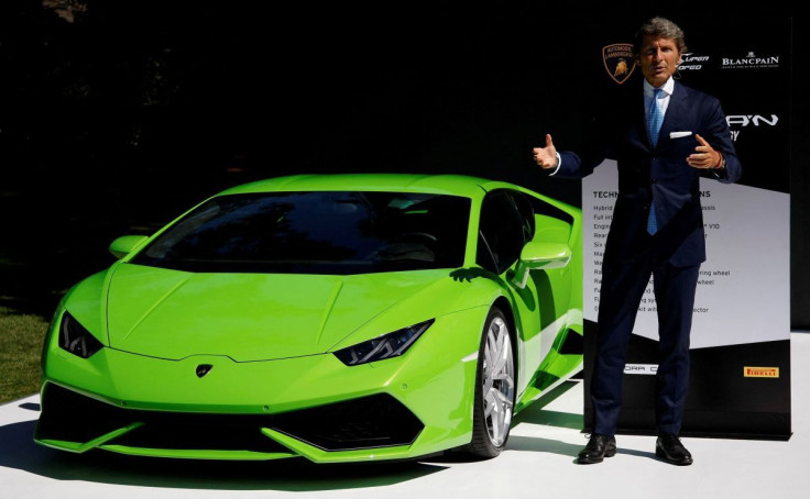 Lamborghini President and CEO Stephan Winkelmann stands with a Huracan during The Quail, A Motorsports Gathering car show in Carmel, California, August 15, 2014.