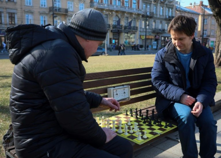 Chess grandmaster and reigning Ukraine champion Andrei Volokitin (R), plays against an amateur in the western city of Lviv, Ukraine's 'chess capital'