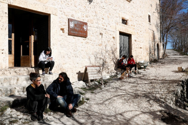 Residents of Rocca Calascio enjoy a sunny day in the small village of Rocca Calascio, Italy, February 25, 2022. 