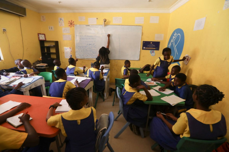 A teacher writes on the board during a class that is part of a special STEM programme for children from poor families at the Knosk Secondary School, in Abuja, Nigeria February 18, 2022.