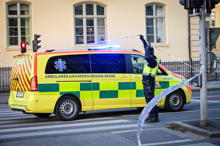 A police officer gives access to an ambulance to the scene of a crime by a school in Malmo, Sweden March 21, 2022. TT News Agency/Johan Nilsson/via REUTERS